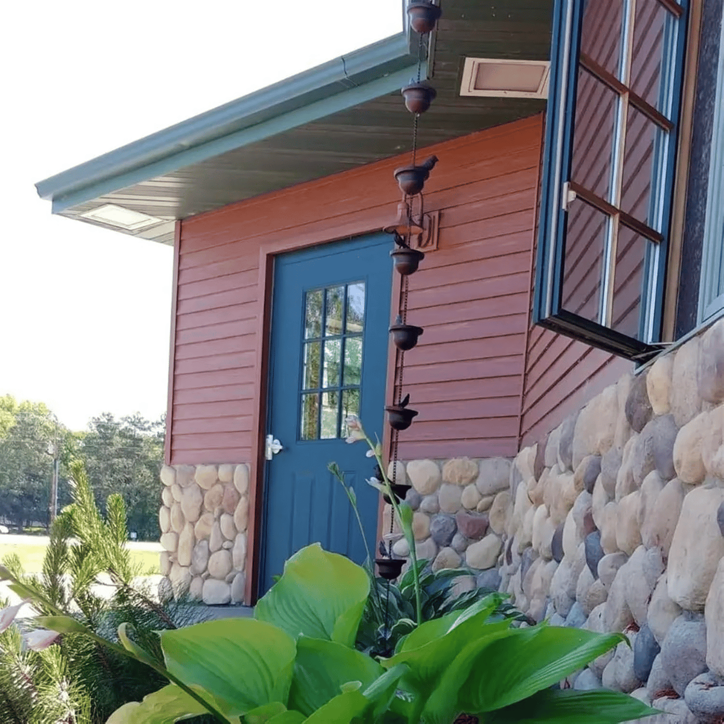 Where rain meets art - decorative rain chain with bird bath design